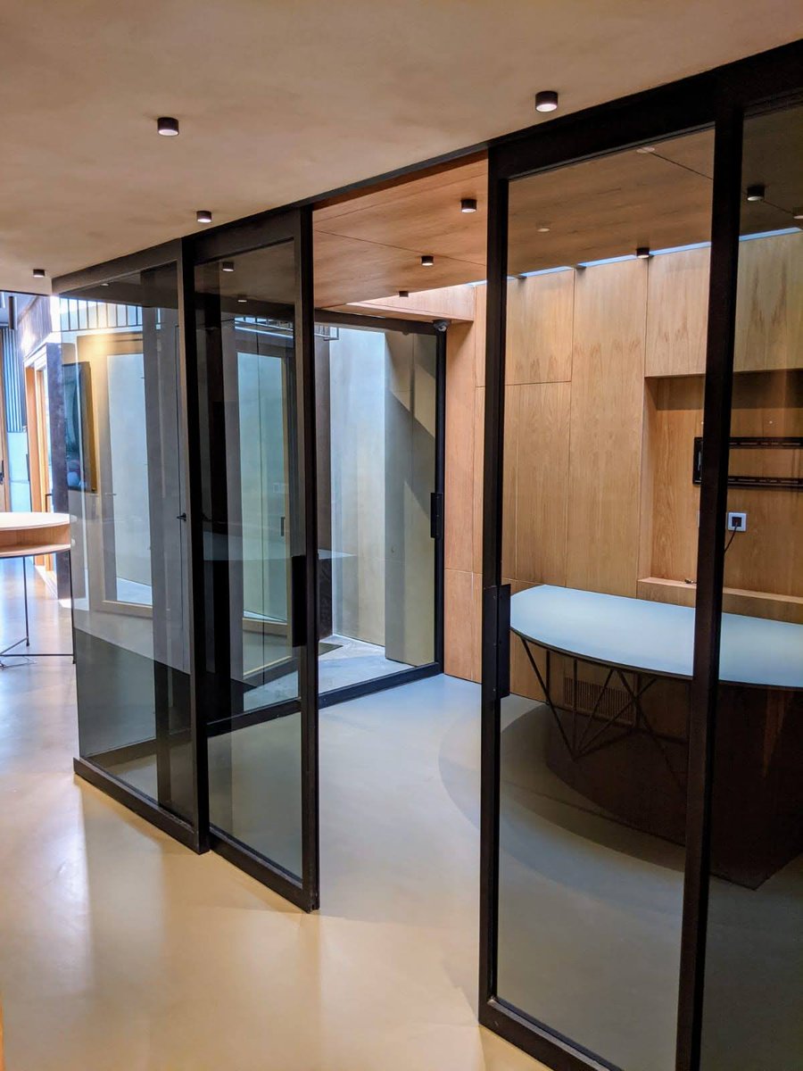ecoviauk's tweet photo. The Ecovia range of oak framed synchronised bi-parting internal sliding doors provide an elegant solution to creating internal meeting or work spaces. Combined with a painted finish, glass to glass 90 degree corner and a privacy tint they really do provide a  stunning solution. https://t.co/rTfq1ldWfT