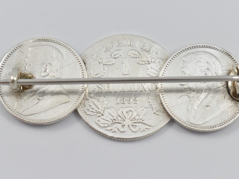 During the Boer War in South Africa it was commonplace to collect coins from enemy combatants and have them made into jewellery once home. This brooch is now on the website.

Boer War silver coin brooch- the coins dated 1892 &amp; 1896.