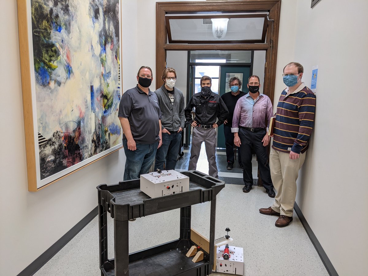 DataRealmInc's tweet photo. The team posing with our new office robot, meet QBii! 
#robot #programming #DataRealm https://t.co/zcbkxNu4zK