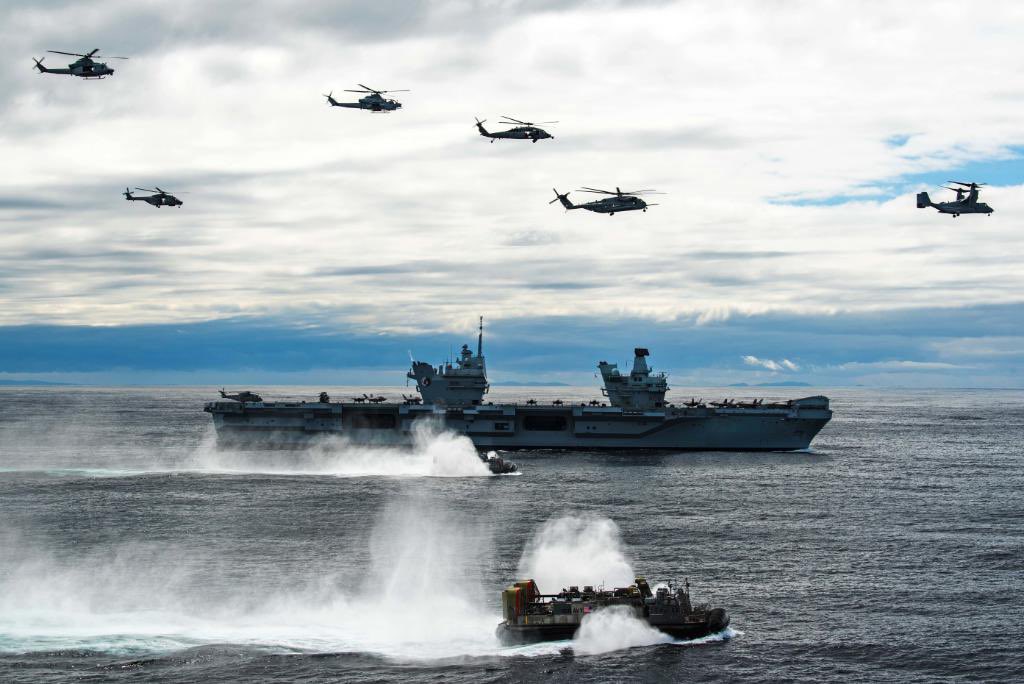 Great shot of Security Cooperation at work!  @USNavy #HSC26, #VMM162 and #ACU4 transit the Atlantic Ocean with @HMSQNLZ