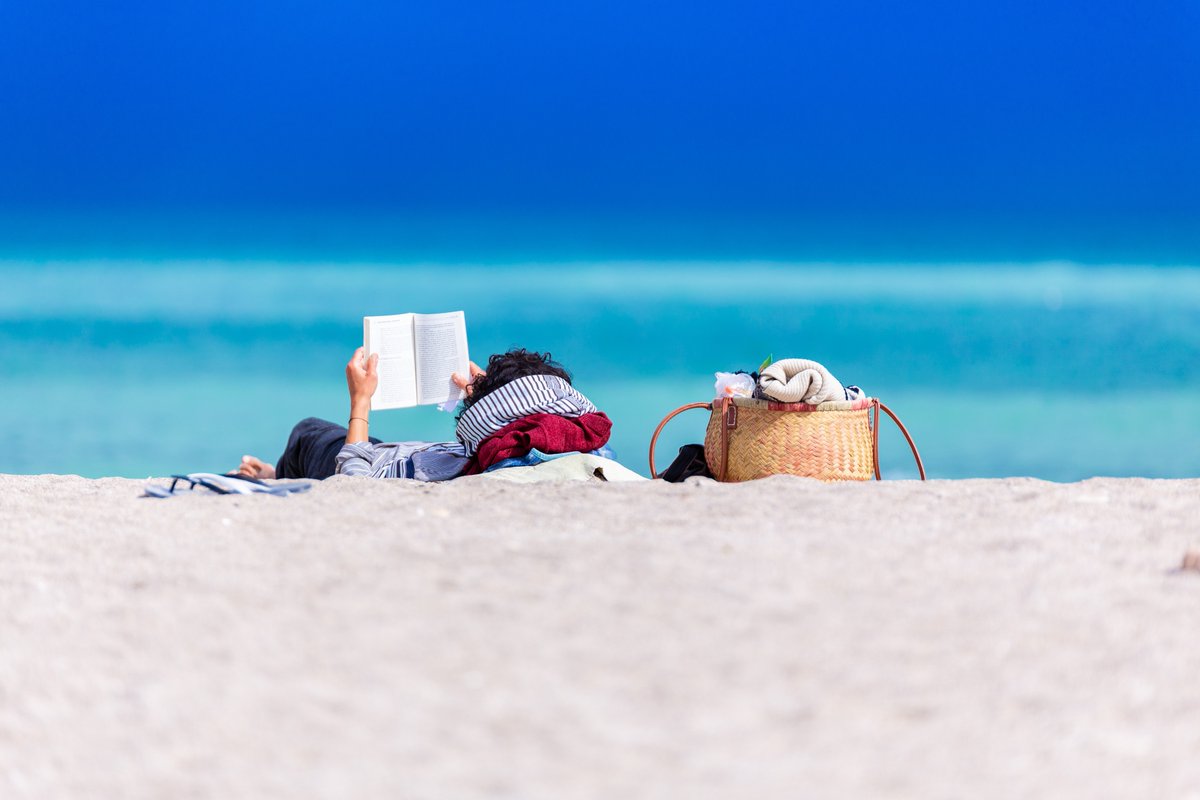 Library_PC's tweet photo. Looking for summertime reads to relax? You know the library has you covered. 
Want a beach read? We’ve got you! Or a good memoir, biography, or mystery? Yup, we have those too! The stacks are open for browsing, including our bestseller wall! #SummerReading #ProvidenceCollege https://t.co/UBplmkcMYN