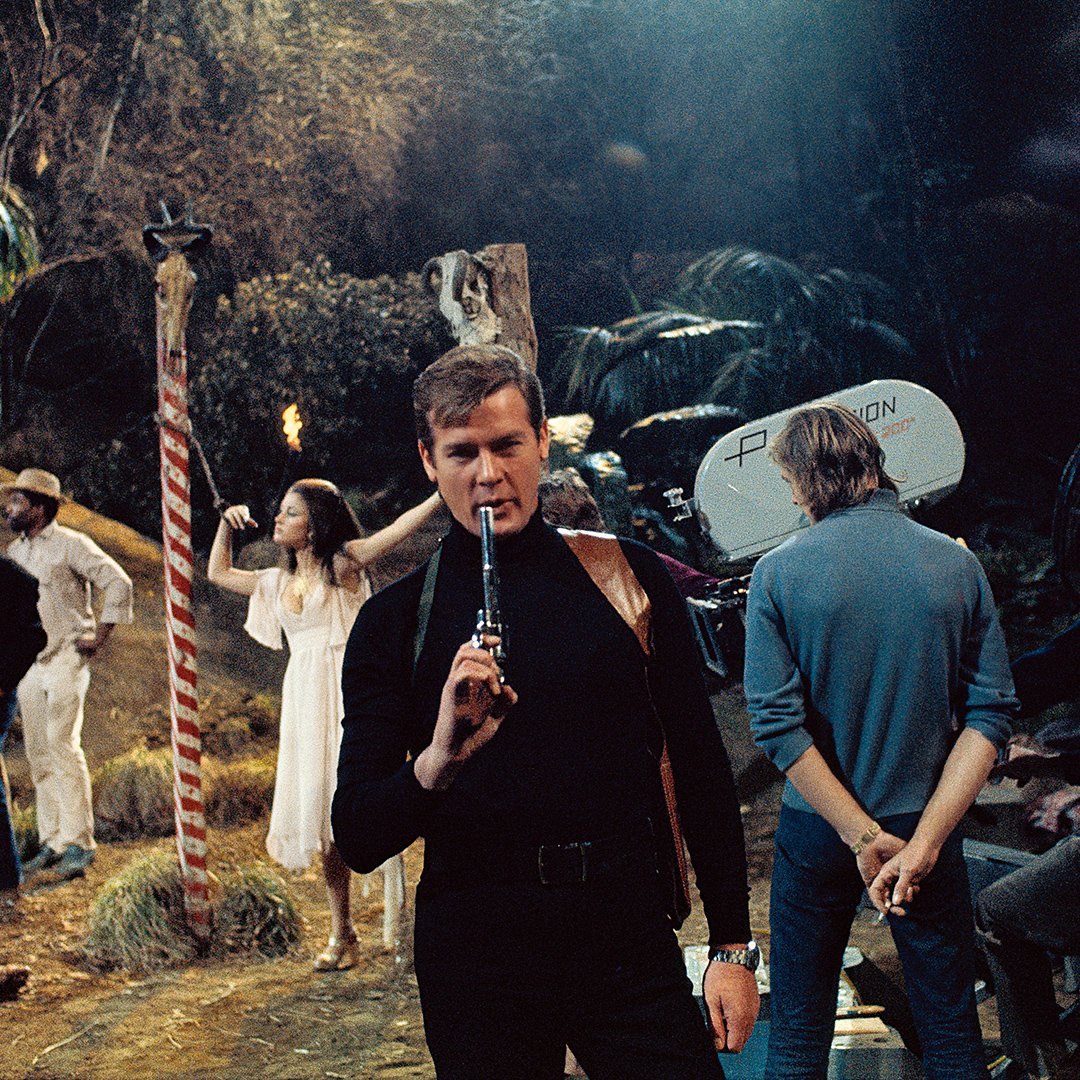 007's tweet photo. Today in 2017, Sir Roger Moore passed away. He played James Bond seven times. What’s your favourite memory of his 007? https://t.co/8upQA5o2c9