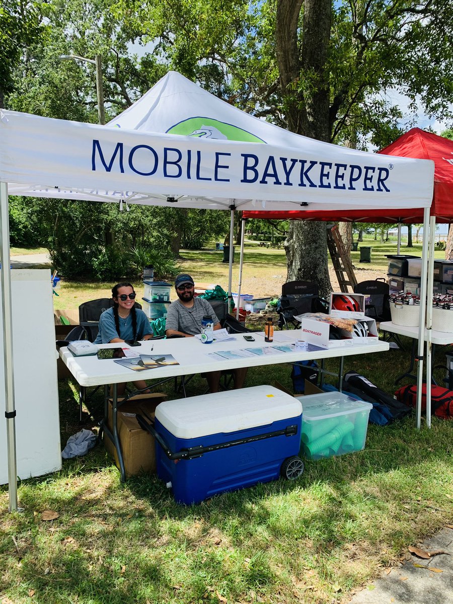 MobileBaykeeper's tweet photo. Packet pickup for @GrandmanTri happening at Fairhope Pier until 6PM today. Come down and see us. #grandman #raceforcleanwater https://t.co/UDkUdeJXbg