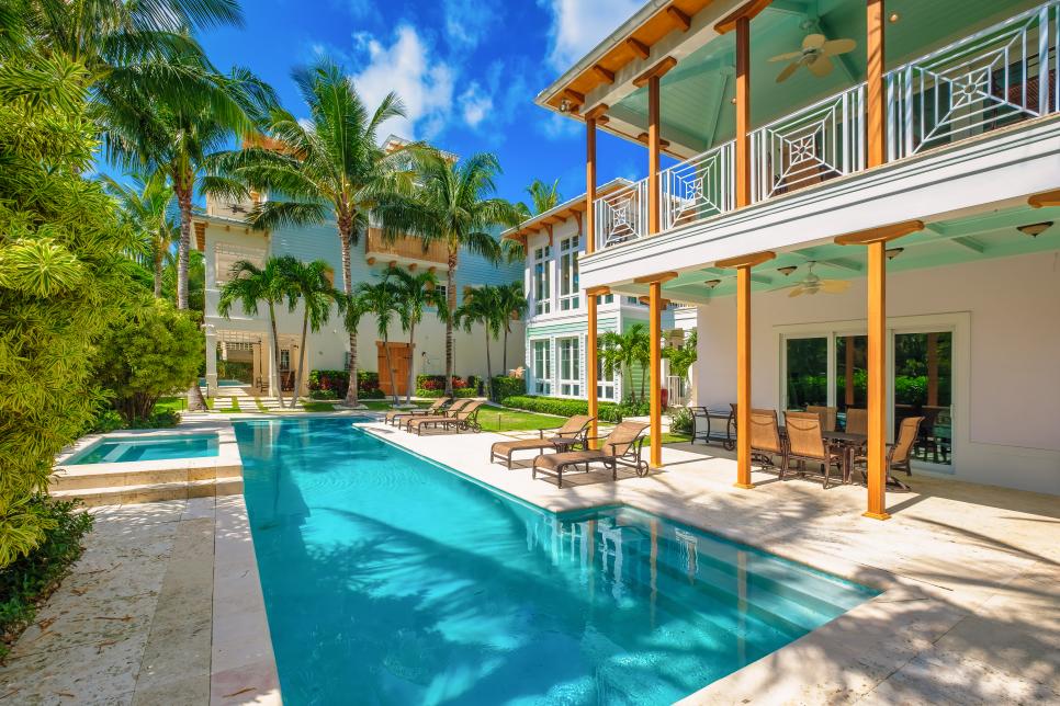 Pool and Spa in Tropical Backyard by Balistreri Real Estate