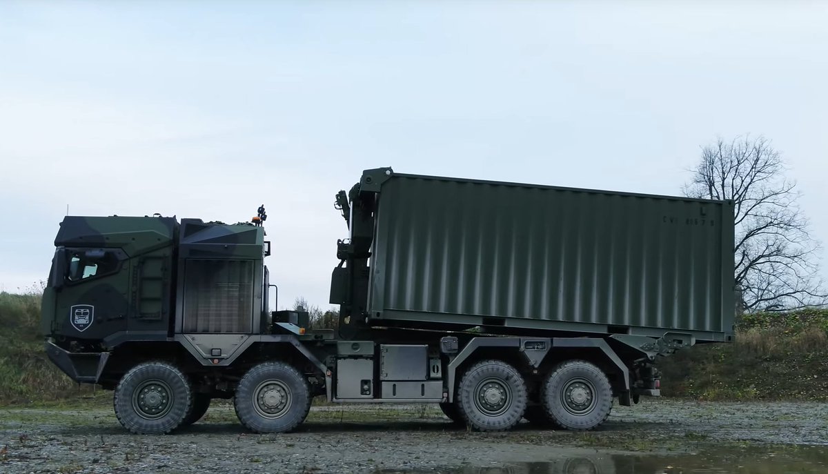 New Auotmated Load Handling System (ALHS) loads/unloads flatracks and contains (paging  @thinkdefence) from within the cab by single operator. Whilst details are scarce, claims point to signficiant off-axis capability for loading, making it viable in austere military applications