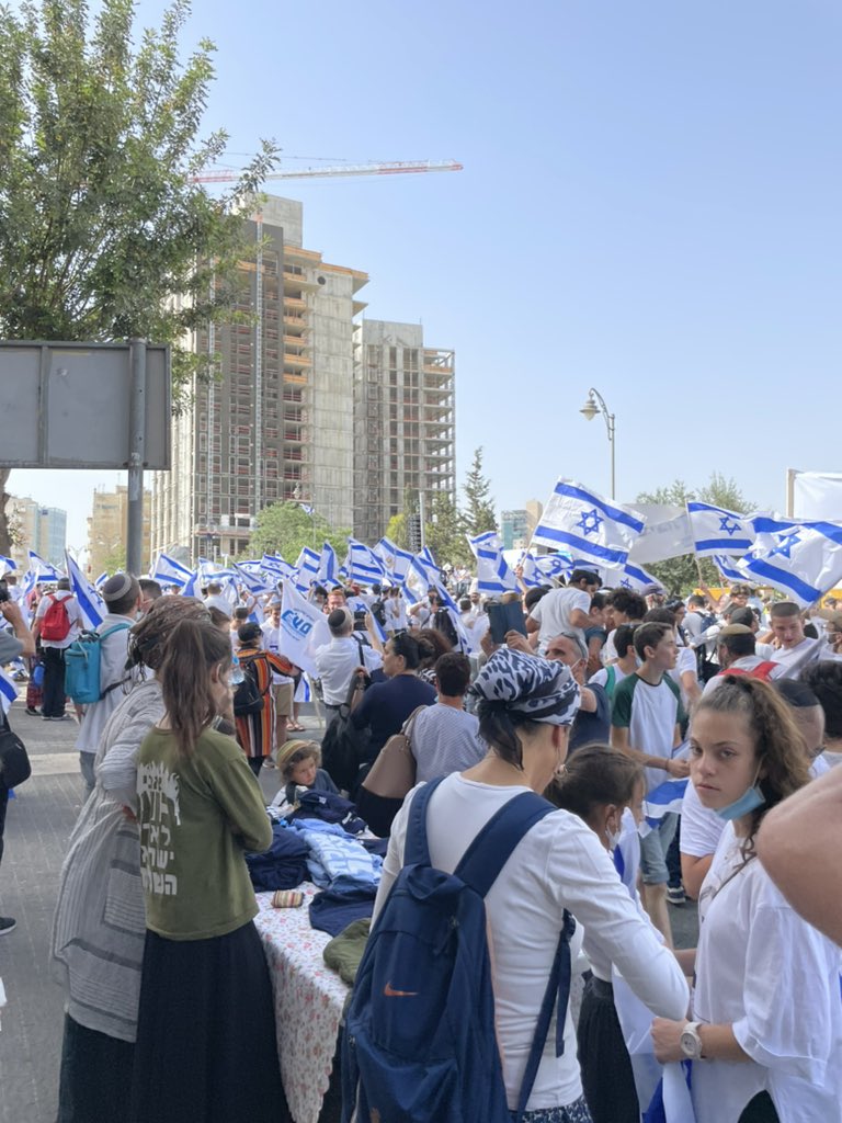 Surreal. While young Palestinian men barricade themselves in Al Aqsa mosque, Israelis marching for  #JerusalemDay and “march of the flags”