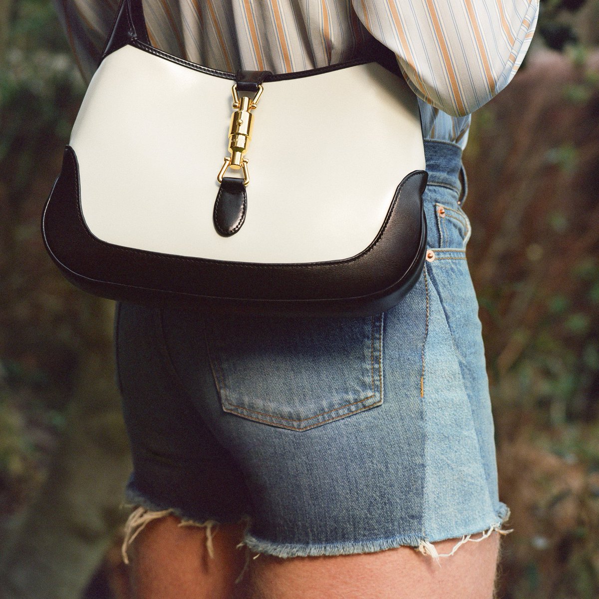 Bag sporting is a mandatory pastime for men today, and here’s a great <a href="/gucci/">gucci</a> example that makes it even more appealing. The Jackie 1961 bag, here in a two-tone variety. The shirt and shorts are Gucci too. Photo by @_ryniewicz, styling by Stuart Williamson.