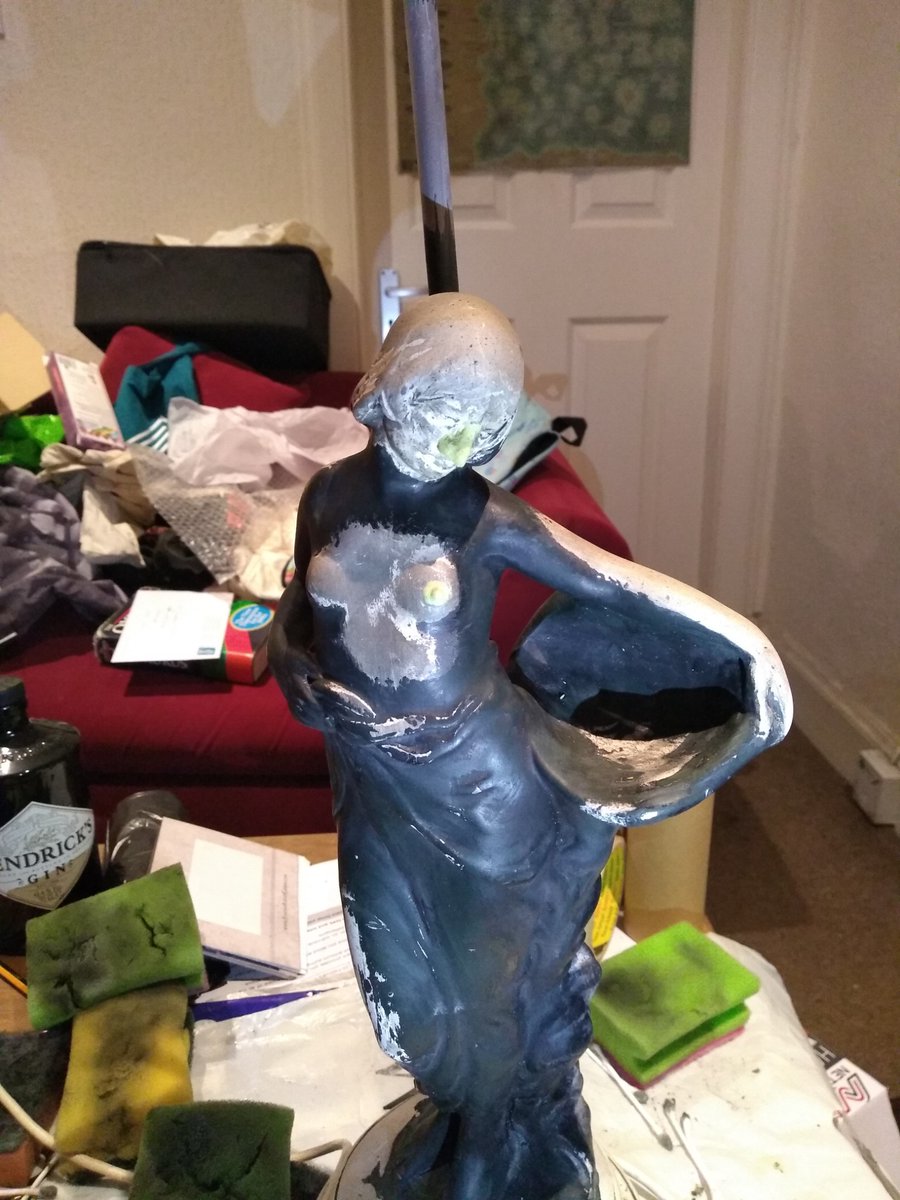 r_e_wilkinson's tweet photo. when we got her the whole thing was coated in thick black acrylic, her nose was broken off and painted over, and she was just attached to the lamp post with a clog of plaster. This is her once we'd started stripping the paint and remodelling the face vs her on Friday https://t.co/Lfjsi63xya