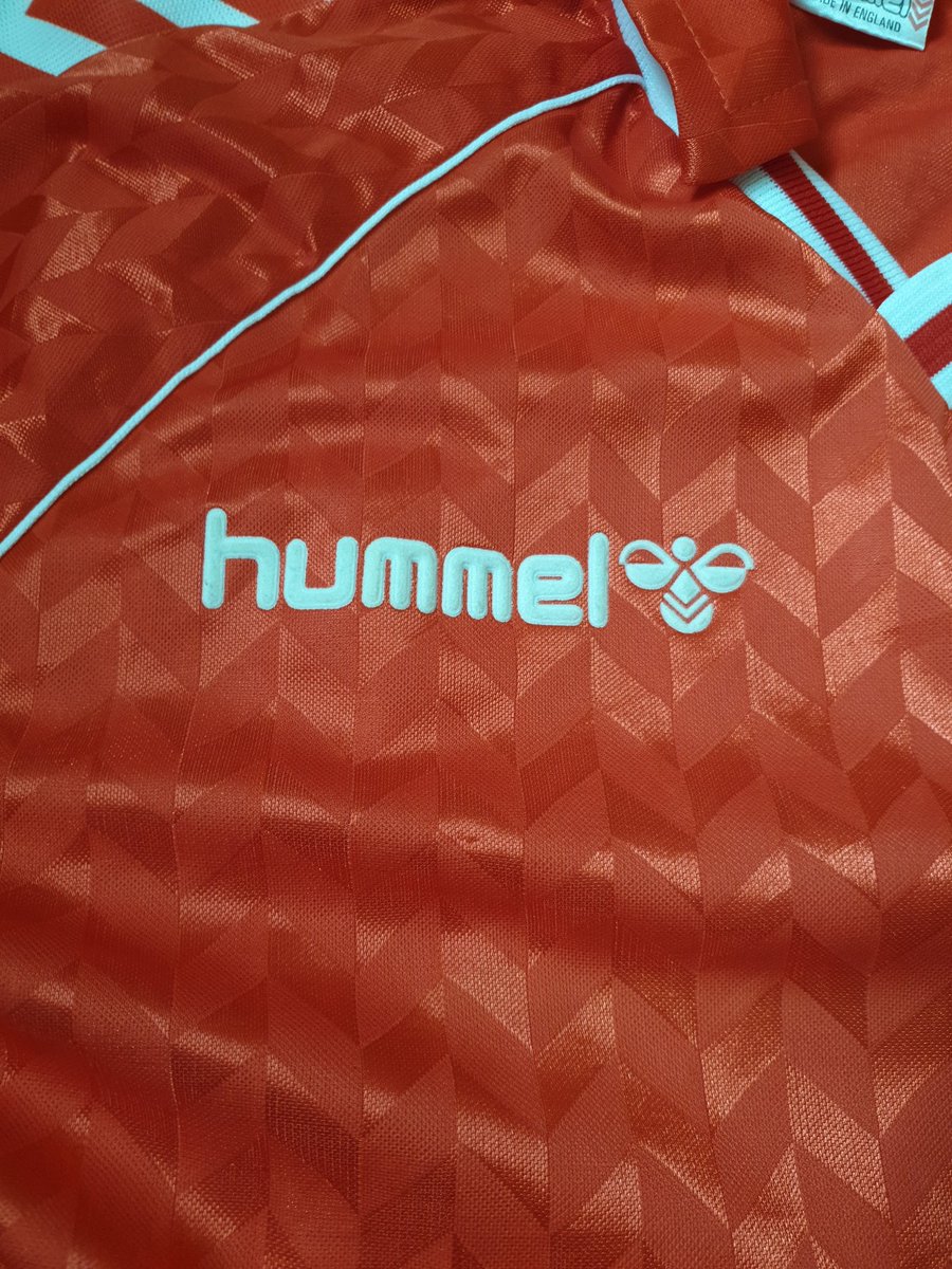 'Retro' HummelYou need to be looking for a glued on felt badge and not embroidered. Embroidered badges were only on player issue Also keep an eye out for the colour. Modern ones seem to be a deeper red colour Left Genuine - Right Fake