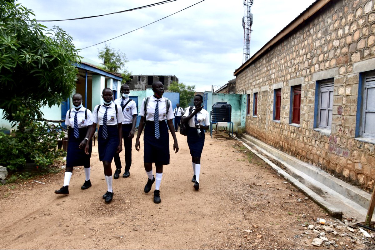 PonnieSheila's tweet photo. Smiles and laughter today in #SouthSudan as @DioceseofJuba Secondary School reopens to #Students. After a year of #COVID19 #lockdown Classmates and #teachers welcome each other. @unicefssudan @EUinSouthSudan @CityReviewJuba @SSOT_tweets @VOAAfrica @RFIAfrique @bluemarbletales https://t.co/Nfy4eEOXnL