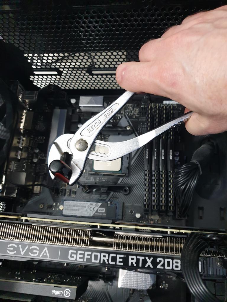 See those screws on the mounting thing around the CPU? They're deciding they're not coming out. Not for any screwdriver.