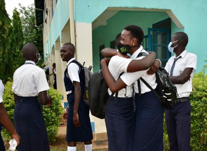 PonnieSheila's tweet photo. Smiles and laughter today in #SouthSudan as @DioceseofJuba Secondary School reopens to #Students. After a year of #COVID19 #lockdown Classmates and #teachers welcome each other. @unicefssudan @EUinSouthSudan @CityReviewJuba @SSOT_tweets @VOAAfrica @RFIAfrique @bluemarbletales https://t.co/Nfy4eEOXnL