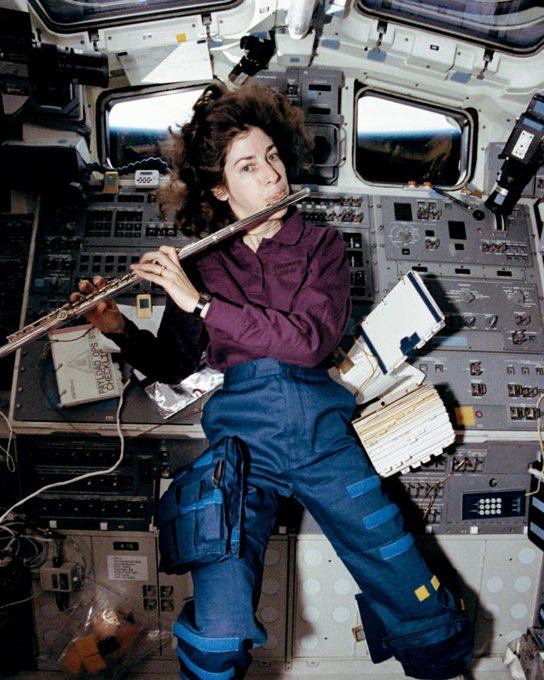 STS-56 Mission Specialist Ellen Ochoa takes a break from a busy day in space to play the flute aboard Space Shuttle Discovery in April 1993.