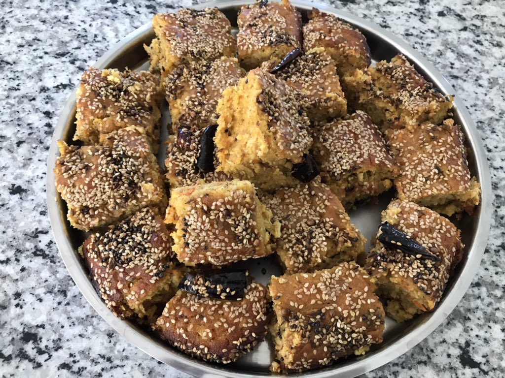 chutneylover's tweet photo. What is this, you ask? Cake, baked dish, something buggy & wormy 😆! It’s handvo, a savory rice & lentils cake with loads of grated vegetables. We cut it too! Though the name is worthy of striking terror, it tastes wonderful esp with #hotchai https://t.co/iFMMhZzZRY