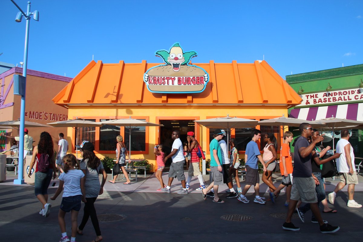 Parade float with characters from the film Hop, Krusty Burger, Moe's Tavern, Sonder Quest in Moe's.