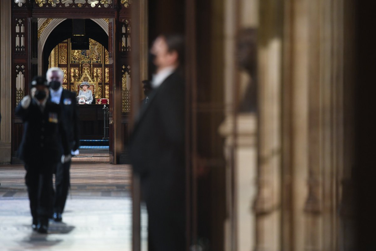 Image of the Queen sitting on throne