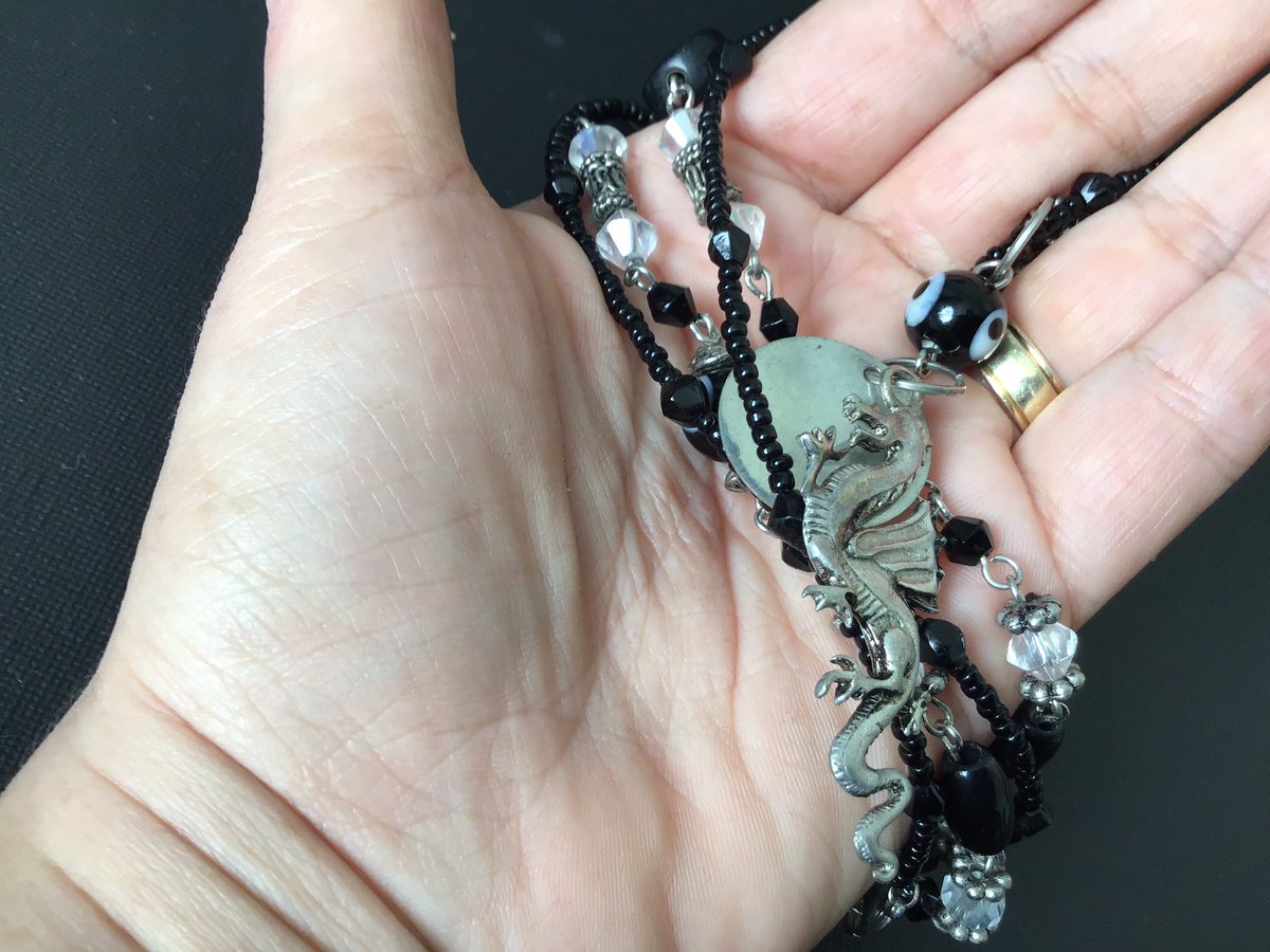 MNukshuk's tweet photo. New in our Etsy shop link in bio. Keep luck on your side and negative energies away with this necklace made with obsidian stone and a dragon pendant for luck. #Chakra #jewelry #etsyshop #etsyseller #handmade #goth #wiccan #Accessories  #SupportLocal #SupportSmallBusinesses https://t.co/n3BRBwGOfo