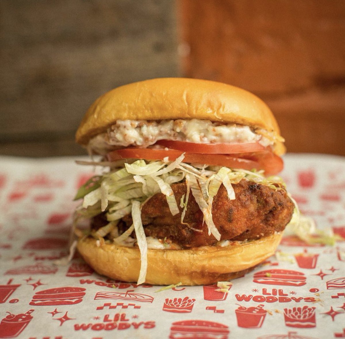 #lilwoodysburgeroftheweek: Buffalo Bacon Fried Chicken Sandwich —

Blue Cheese Bacon Mayo
Shredded Lettuce
Sliced Tomatoes
Fried Chicken Dipped in Buffalo Sauce
Mayo

only available on our website lilwoodys.com, or call for pick up, or order in-person at all 3 locations