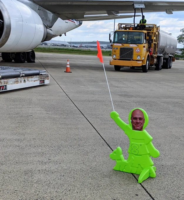 Plastic traffic person with John's head pasted on to it