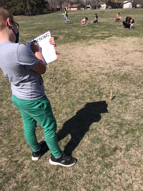 ElemWhford's tweet photo. More math fun outside! Today 2/3 is practicing fractions by finding the fraction on a popsicle stick and filling in their fraction bingo card. @RegPublicSchool https://t.co/AZpXKtUvkw