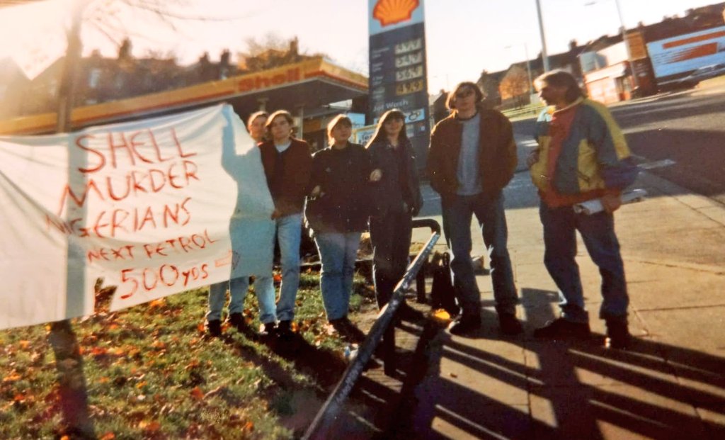 KopCraftsman's tweet photo. My sis just sent me a picture that brought back a lot of memories. My first #HandmadeBanner wasn't an @LFC banner, it wasn't a work of art, but it mattered. Borough Rd, Birkenhead, 1995. "SHELL MURDER NIGERIANS - NEXT PETROL 500 YARDS" ✊. Petrol station shut by lunchtime🛢️ https://t.co/VhO52PnmiB
