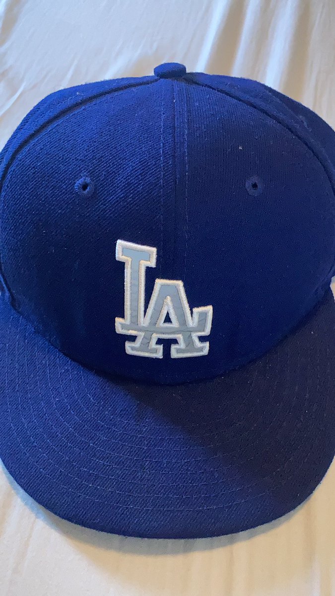 JustAKidFromPR's tweet photo. Just found this Dodgers hat as I’m packing up to move. I was so down after losing in 2017 that I wrote #2018WSChamps on it the day after we lost. Lost in 2018 and wrote #2019WSChamps over it. Thank god I didn’t write #2020WSChamps maybe we would’ve lost 😂 https://t.co/27S9Ct0I01
