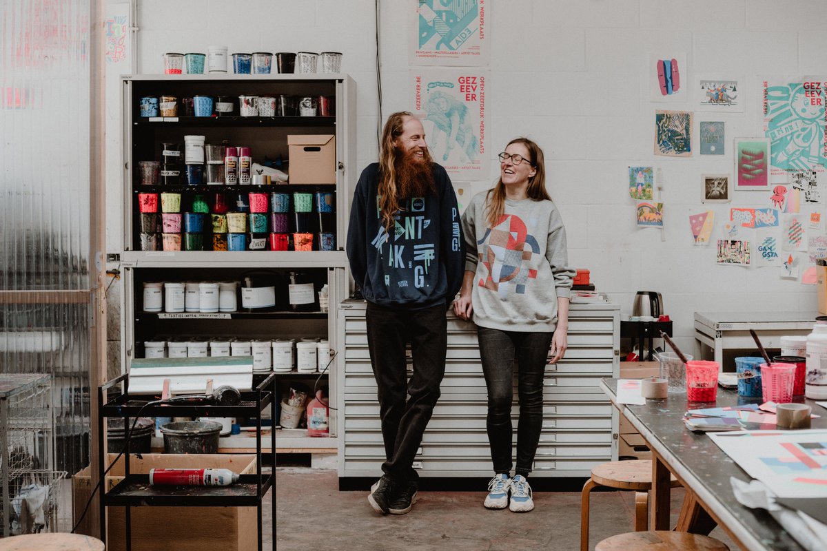 The #graphic designers and screen #printers Jasper &amp; Els create bright posters in eye-catching colors. Get to know them further in #paperpassionbyarcticpaper, follow the link for the full story: bit.ly/3frzNaz Photo: Kimberley Dhollander #paper #art