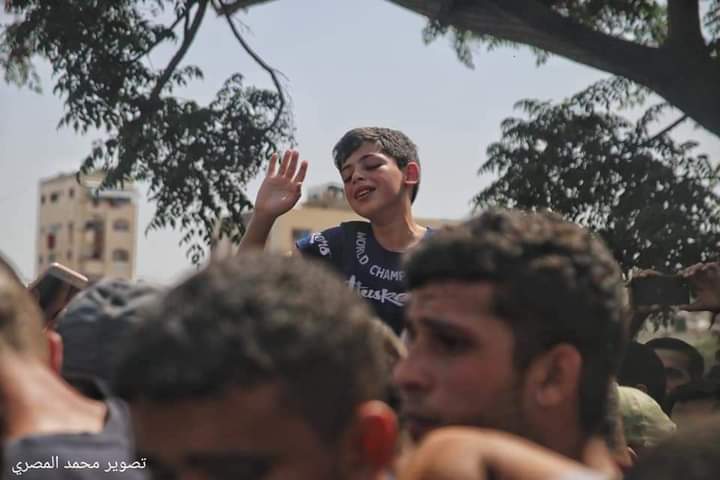 A Palestinian child cries at his father's funeral The child's father was killed in an Israeli missile strike last night. #GazaUnderAttack #StandwithPalestine
