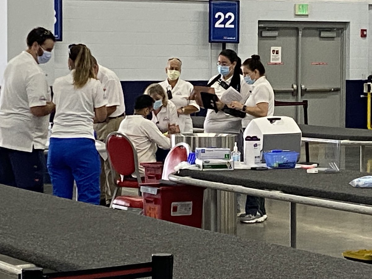 A cruise ship crewmember is vaccinated at Port Canaveral. Cruise workers have been out of work for more than a year and typically don’t qualify for unemployment benefits in the US.