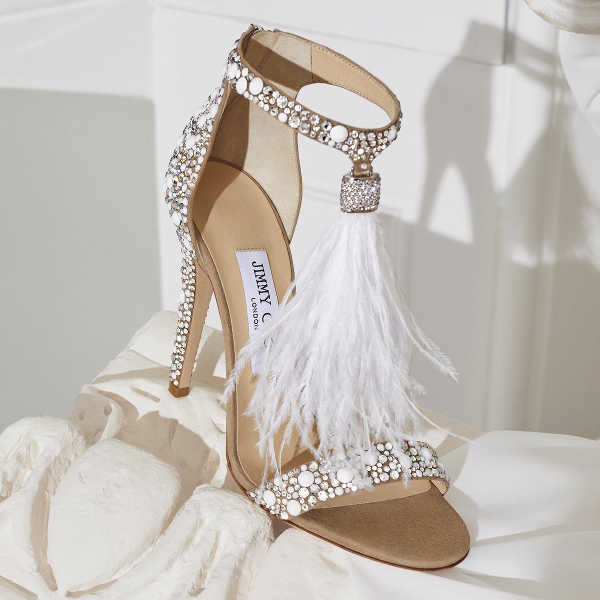 Choose the VIOLA feathered sandals for your big day and make an unforgettable entrance #IDOINCHOO #JimmyChoo bit.ly/3vWVUMz