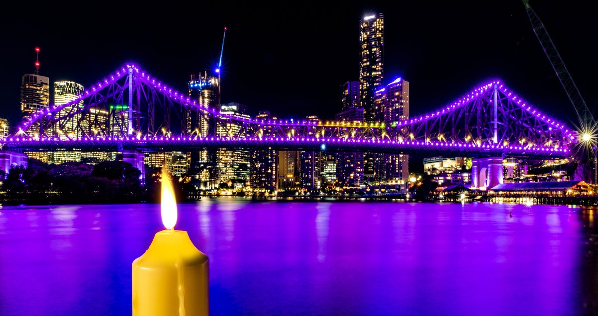 QSuper_au's tweet photo. The annual Candle Lighting Vigil saw Brisbane’s Story Bridge lit in purple to remember lives lost due to domestic and family violence. QSuper is committed to helping Queenslanders experiencing violence and financial uncertainty. #enddv #QSuperCommunity #lightacandle2021 https://t.co/lNcTRcUnys