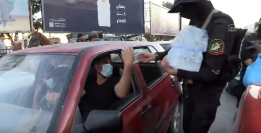 Stopblasphemy's tweet photo. #IsraelTerroristState 
Hamas (Allah bless them) distributing water bottle in ramadan. https://t.co/UJpd7wVATH
