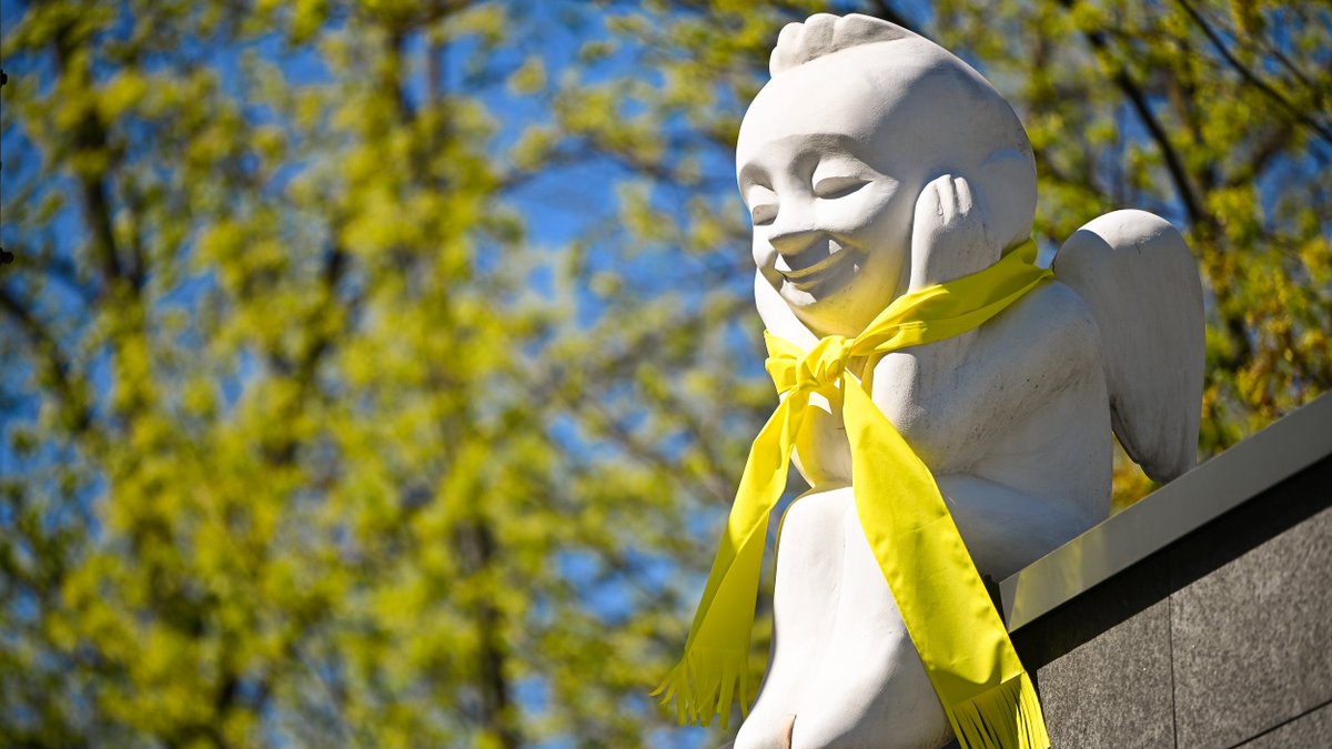LithuaniaMFA's tweet photo. As the city of #Vilnius has decorated various statues with yellow 🟡 clothing items that copy the stage costumes of #TheRoop, the #Lithuanian 🇱🇹 entry for the #Eurovision2021, we also join this great initiative. For the week ahead MFA's guardian angel will wear a yellow scarf! 🎶 https://t.co/cuvlTjGQJS
