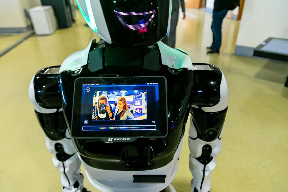 promobot's tweet image. The best thing about the robot, aside from its perfect memory, complete autonomy, and clean looks, is how well it attracts attention. People who see it for the first time would never pass without at least glancing at it. Right there, they can see your brand too.

#Promobot