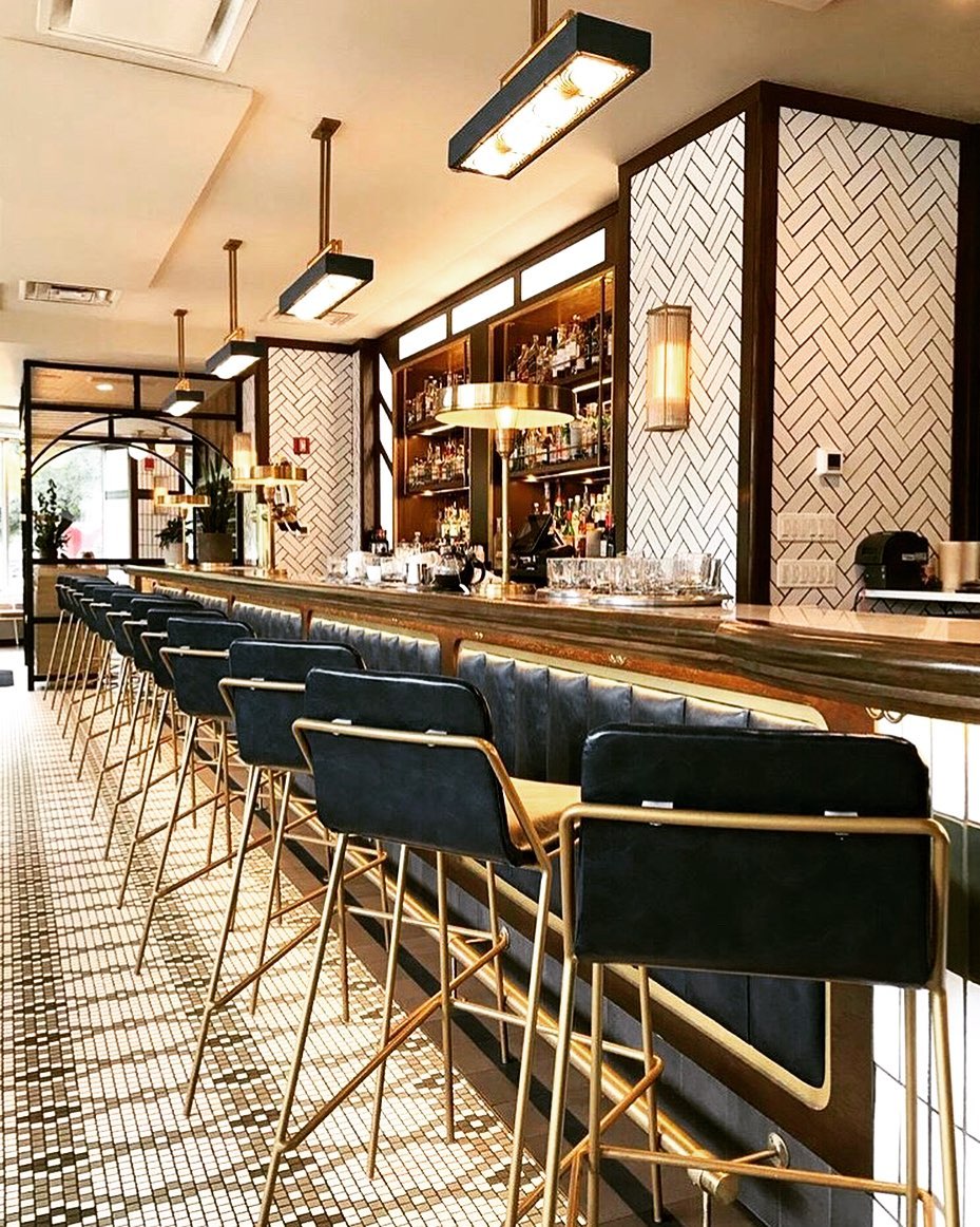 blocHaus's tweet photo. Mixing #materials and patterns is a great way to make a space more dynamic. Some of our favorite materials to mix can be seen in the @kennisonchicago's bar design - Where we used different patterns of tile, brass light fixtures, and leather/brass/wood for the bar front. #design https://t.co/9cENPpgopl