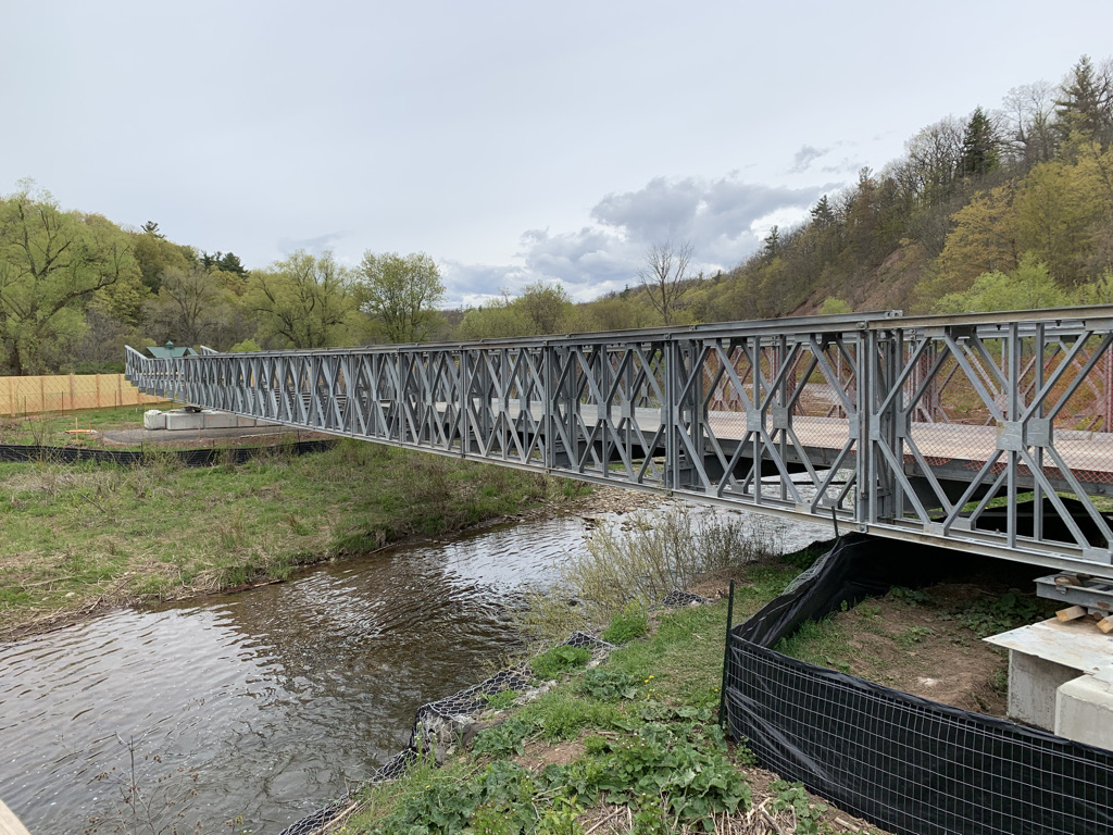 Work has begun on the William Halton Parkway, including tree clearing and grubbing, earth excavation, sewers, &amp; the installation of the temporary bridge. The  bridge will allow for construction access over the Sixteen Mile Creek to build the new bridge footings and substructure.