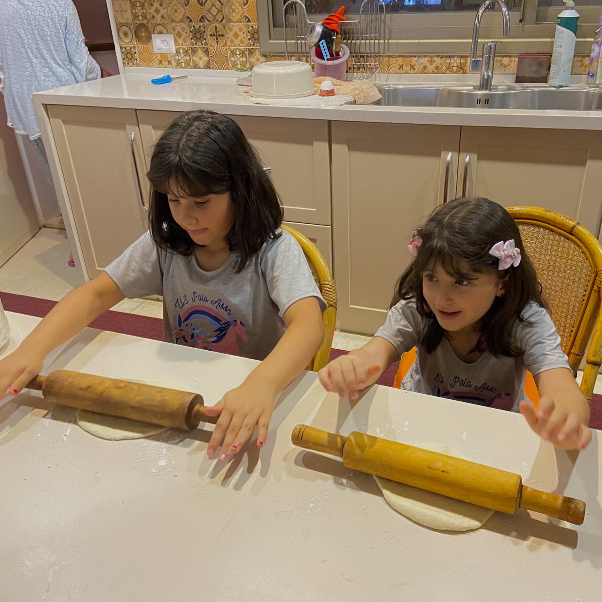 Our main concern, as all Gazan families, is the psychological well-being of or children. The girls helping mom bake a few loafs of bread this evening. #GazaUnderAttack #Gaza #Palestine