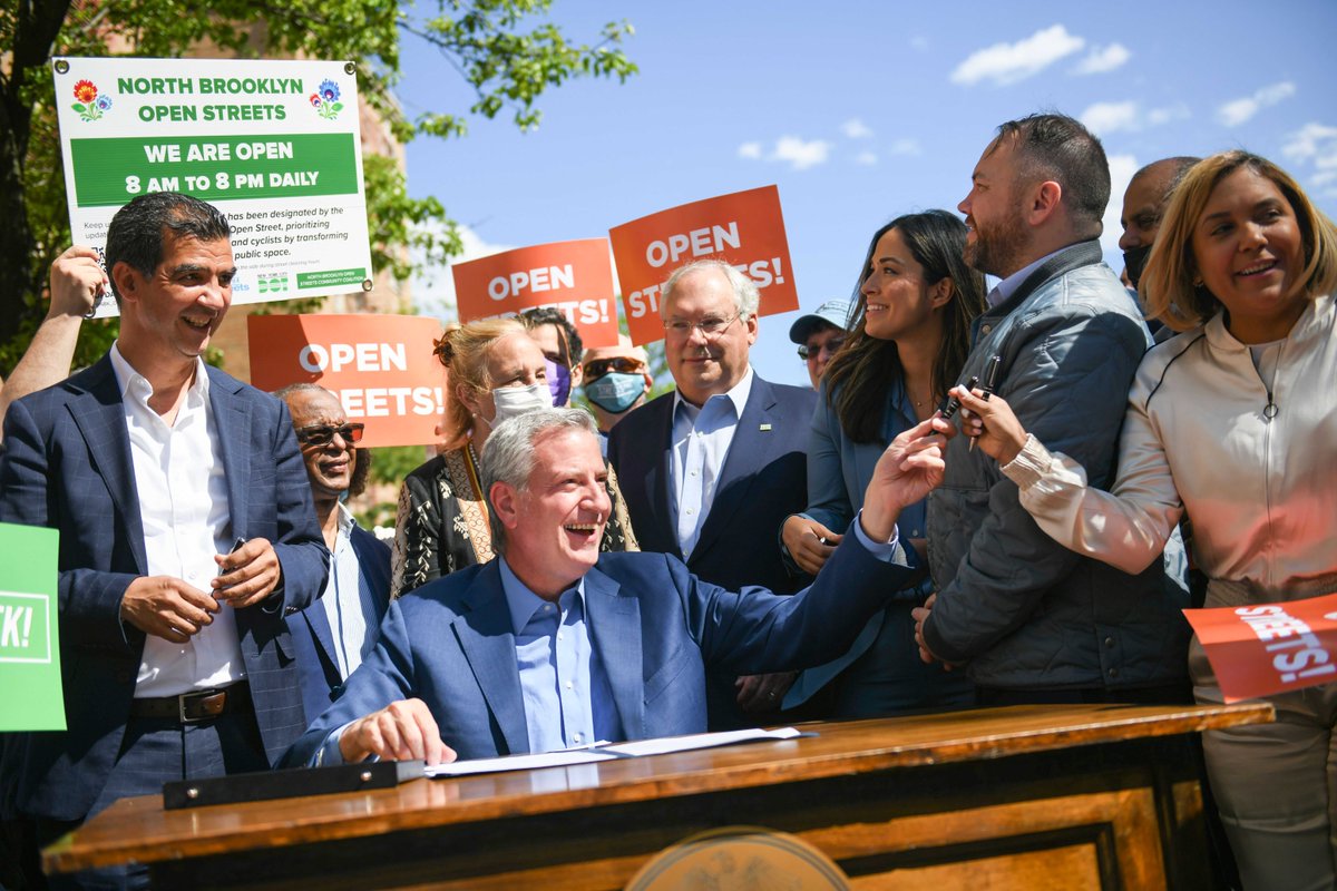 NYCMayorsOffice's tweet photo. One signature later and #OpenStreets are PERMANENT! #StreetsWeek (!!!!) https://t.co/NHIcElge6z
