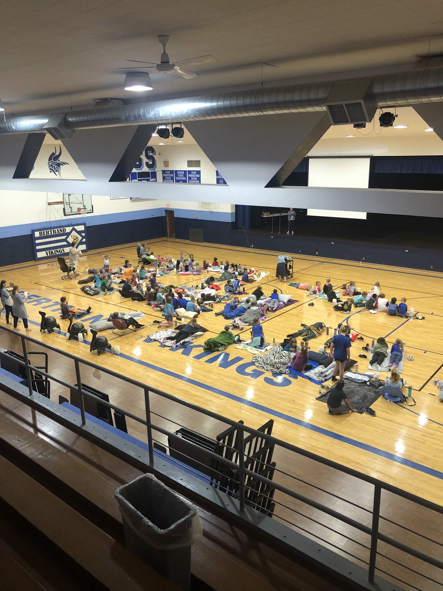 k_holland3's tweet photo. These @BertrandVikings elementary kiddos who met their AR goals the second semester had pizza for lunch, and are now camped out and ready to watch a movie in the gym with popcorn. #vikingnation #movieday #reward #NEreads #elementary #campout https://t.co/KDQyAVbWny