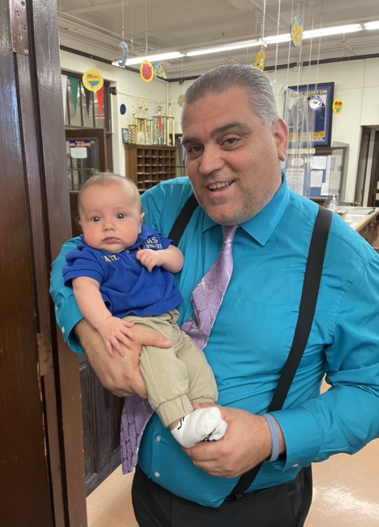 <a href="/ebjets/">East Boston High</a> Headmaster Brangiforte welcomed our newest EBHS community member on his first day of school! Our science teacher <a href="/mr_faizEBHS/">Mr. Faiz</a> made sure his “baby jet” was ready for school in his  uniform! Thank you, Andrew, for such a lovely visit! 💛💙