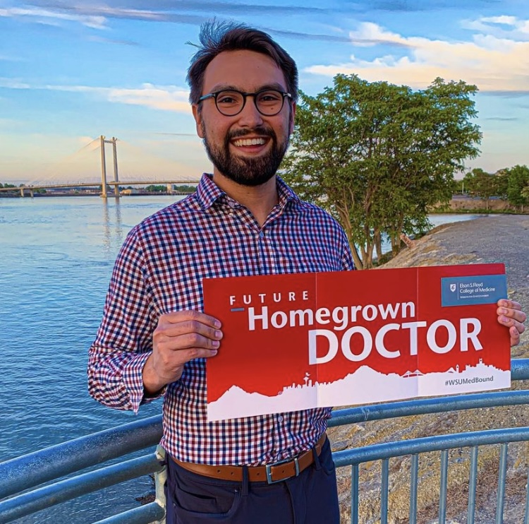 WSUMedicine's tweet photo. Say 👋 to incoming MS1 student, Carson Bergstrom! “It’s such a unique thing and an honor to come back home to learn from and eventually serve my community,” he said.

🎉We couldn't be more excited to have Carson join #WSUMed25!

#WSUMedBound #Cougdocs 🥼 https://t.co/6htwE2AzIZ