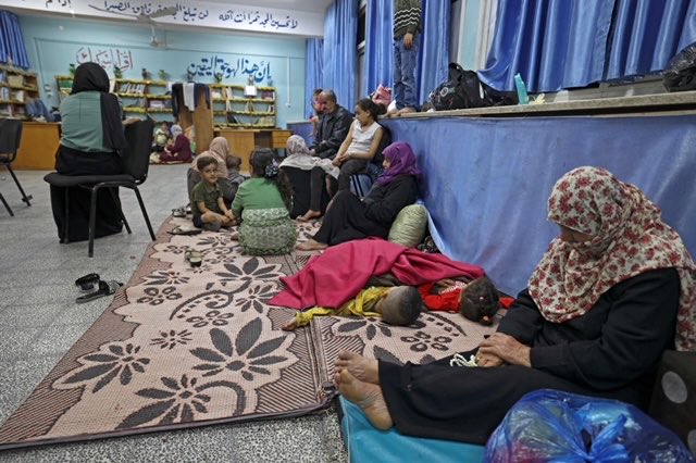 TamaraAlrifai's tweet photo. Civilians in #Gaza seek shelter in @UNRWA schools, feel desperate, air strikes+ #COVID19: too much https://t.co/uAhNiI2L4X