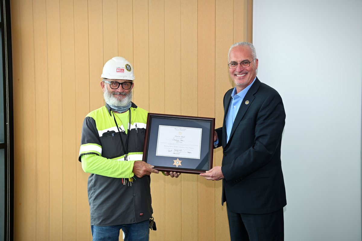 BELLConstCo's tweet photo. In celebration of our completion of the @NashSheriff HQ project (ahead of the original schedule!), @DaronHall7 & the DCSO surprised #BELLConstruction Superintendent Tommy Carr with an ⭐Honorary Deputy Sheriff's badge⭐ & certificate. We are so proud of Tommy and our team! https://t.co/mAzqhDDfpx