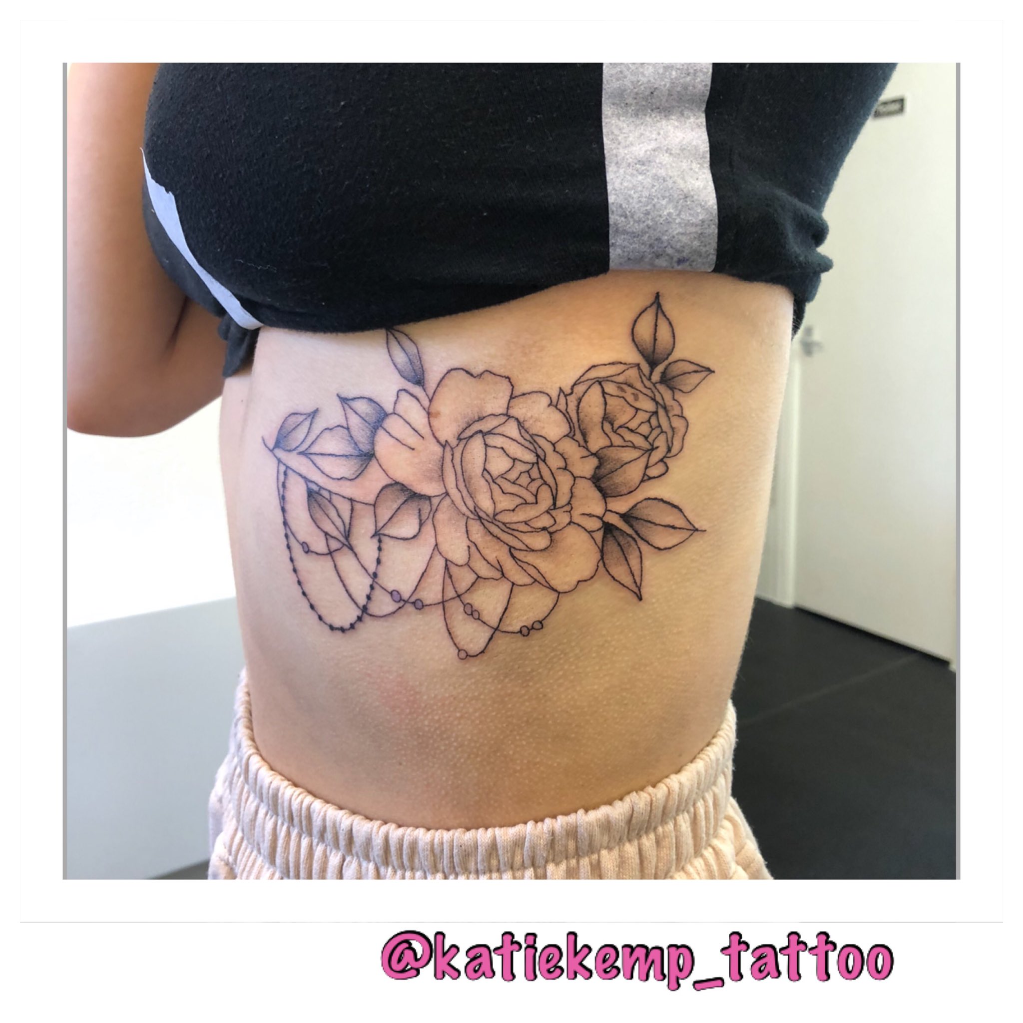 Subtle wildflower tattoo on the rib cage  Tattoogridnet