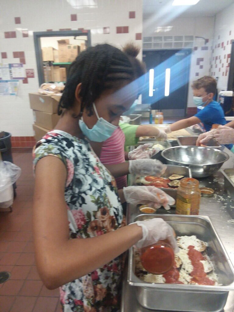 RvpElementary's tweet photo. Both of our Cooking Clubs worked together to make delicious eggplant parmesan today. 3rd grade breaded and roasted the eggplant, while 5th grade assembled the final dishes. #rvprocks #rvpbakestars #teamrvp https://t.co/uFJnvOM3eN