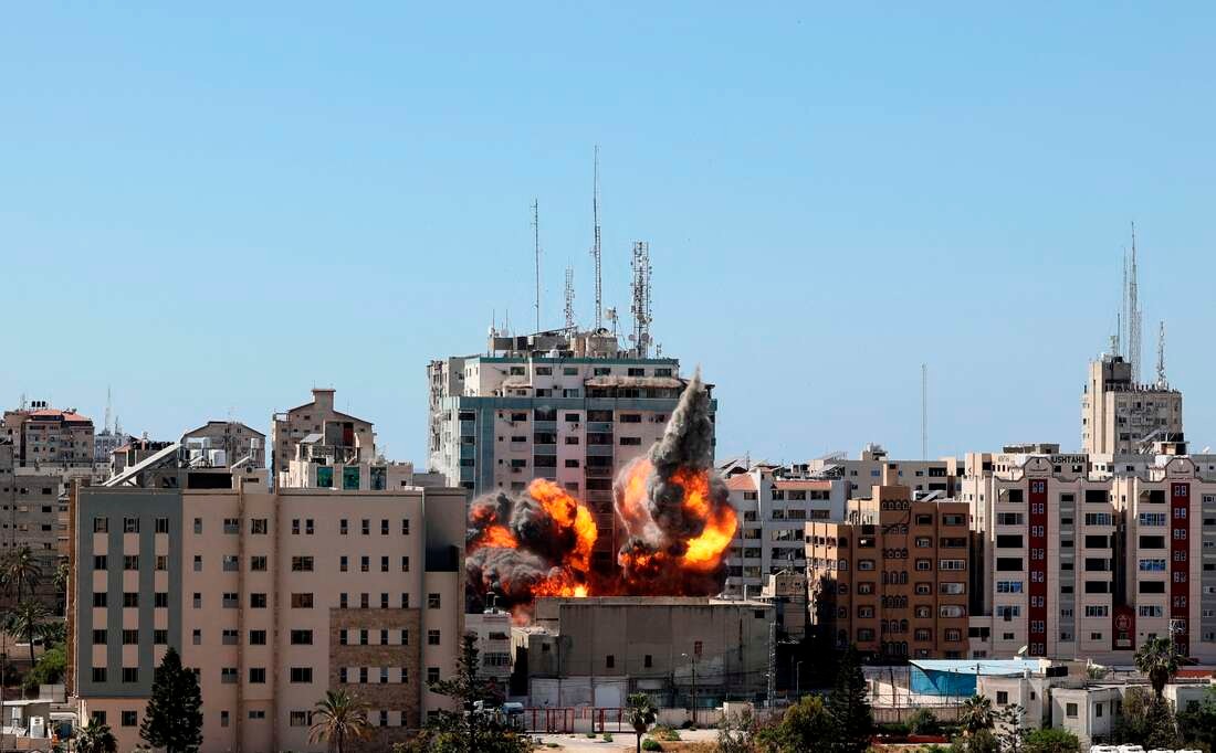 ISRAELI AIR strike demolishes 13-floor building housing Al Jazeera TV and US news agency The Associated Press in Gaza Strip.