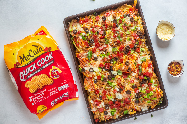 AD Easy Sheet Pan Supreme Pizza Fries couldn't be simpler.  Start with <a href="/McCainFoods/">McCain Foods Canada</a> Quick Cook Waffle Cut Fries, which cook in half the time with no flipping required, top with sauce and toppings and dinner is ready!🍕🍟bit.ly/33KRNqL #mccainquickcookfries #noflipfries