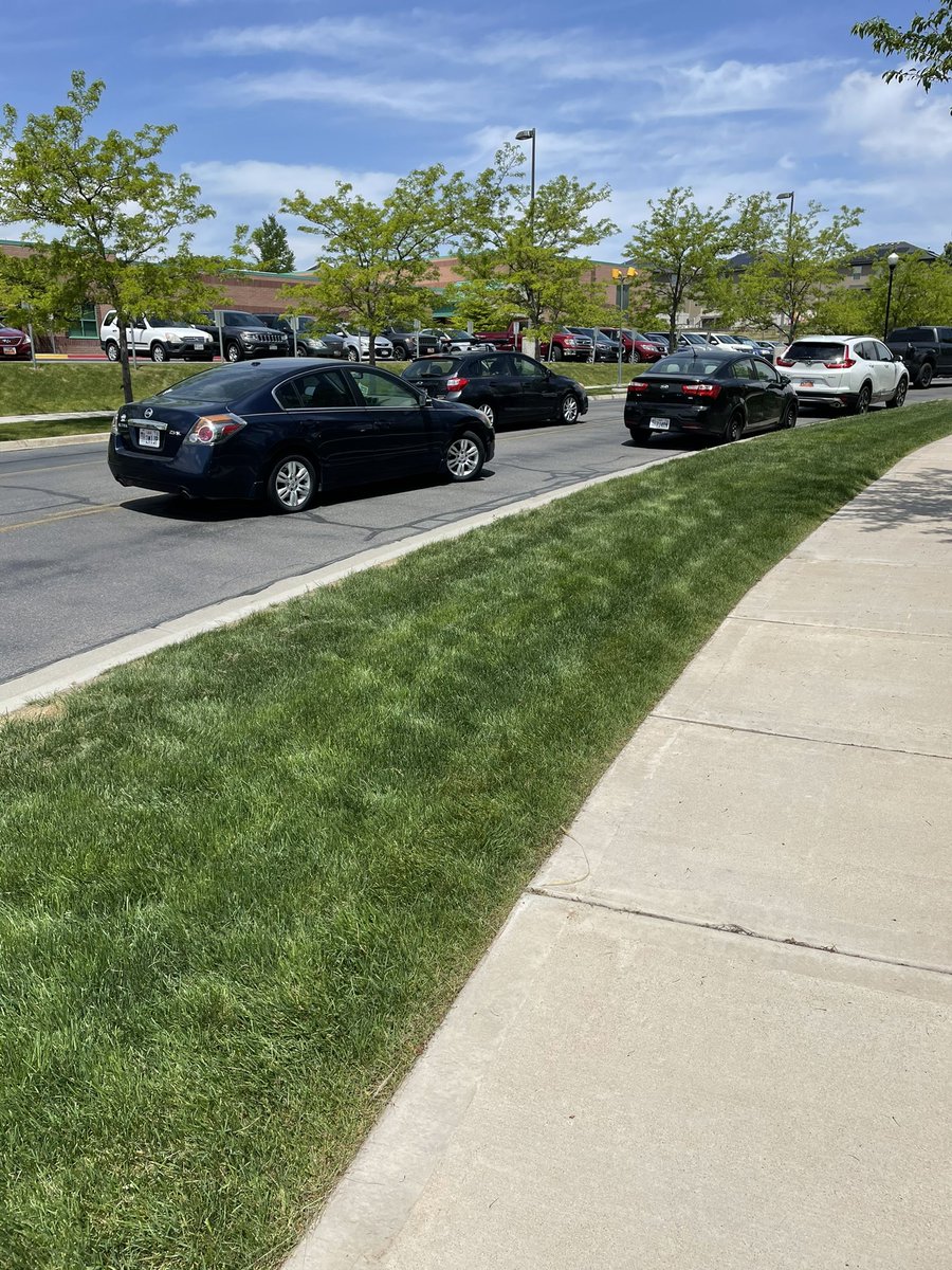 JakeHatch's tweet photo. That is a parked car in the middle of the street. No driver inside etc. Just decided to park in the traffic lane while they watch their child play youth soccer in Saratoga Springs. I get not wanting to ding your rims potentially or you might running late, but come on now...🤷🏼‍♂️ https://t.co/eH8BmunaSC
