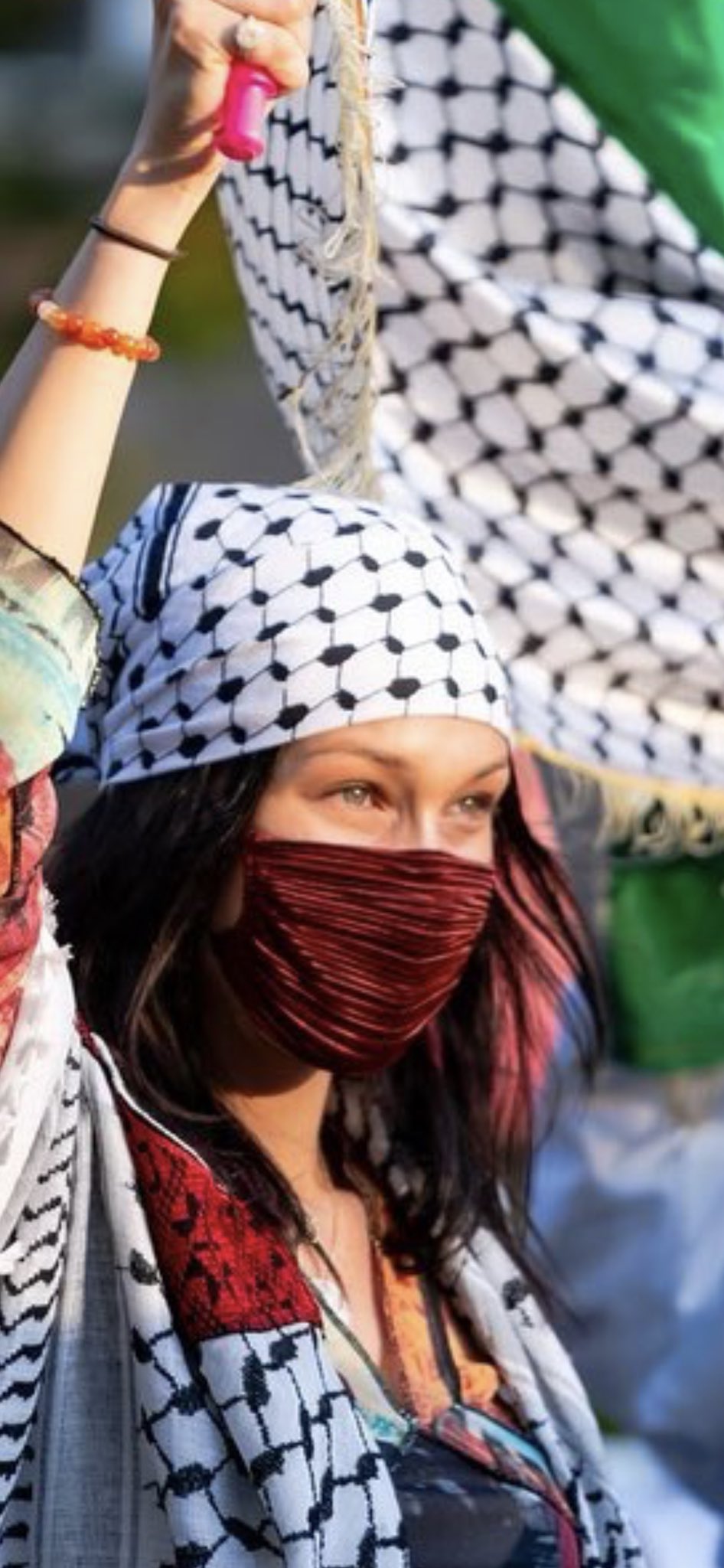 Tom Fordy on X: Bella #Hadid joins pro-Palestine march in NYC 🇺🇸wearing  a traditional dress, a #Keffiyeh, a face mask and waving a large  Palestinian Pale🇵🇸 flag as she marched along with