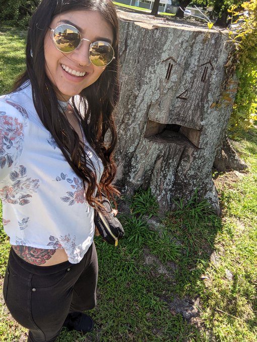 Found this tree trunk with a face on it. (It's a fire pit and still rooted in the ground!)   This trunk